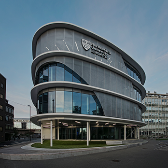 Worms-eye view of the front of the CIS building on a sunny day.