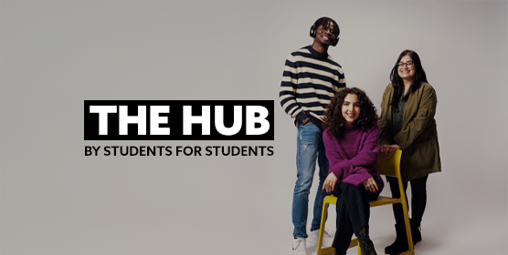 Three Northumbria Digital Content Creators stood together, smiling and looking directly at the camera. There is text embedded on the image that reads: "The Hub - by students, for students"