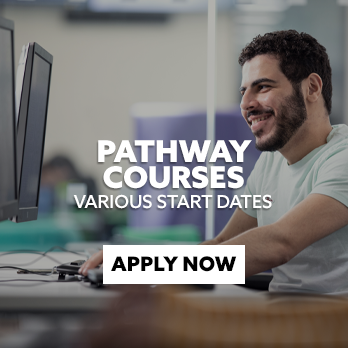 A student smiling whilst using a computer. There is text embedded on the image that reads: "Pathway Courses - apply now"