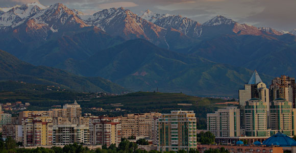View over Almaty with snow capped mountains in the background, Almaty, Kazakhstan