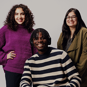 Group shot of three students of differing nationalities as part of the 'I Am Northumbria' campaign.