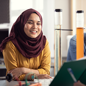 Close-up of an international student in a lab.