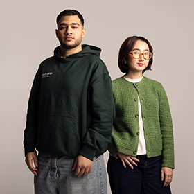 Two students stood looking directly at the camera, as part of the I Am Northumbria campaign.