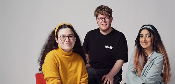 The students of different nationalities sat smiling, looking directly at the camera as part of the 'I Am Northumbria' photoshoot campaign.