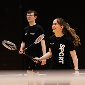 Two student-athletes playing badminton for Northumbria Sport.