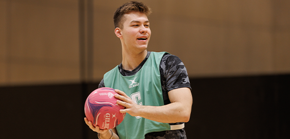Student playing basketball