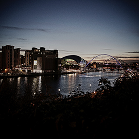 a view of a large body of water with a city in the background