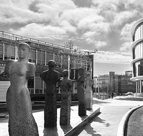a group of people standing in front of a building