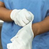 hands putting rubber gloves on