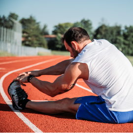 Athlete warming up on a running track