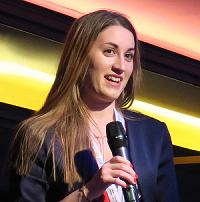 Photo of Natasha speaking at an event