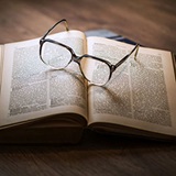 Photo of a pair of glasses on a book