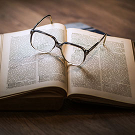 Photo of a pair of glasses on a book