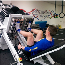 Athlete using equipment in gym