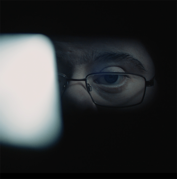 Image of a person's eyes in a dark setting