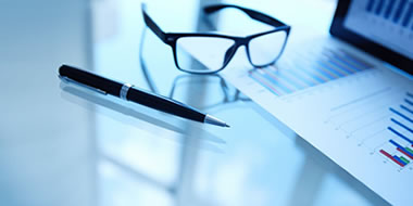 a laptop computer sitting on top of a table