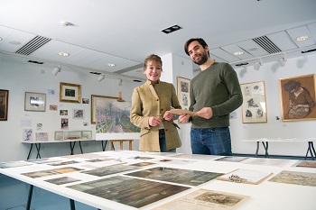Caption:Professor Jean Brown and PhD student Lucas Ferguson-Sharp with some of the pieces from the exhibition