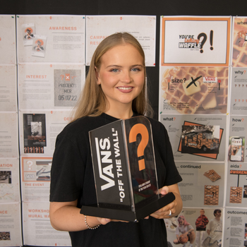 Caption: Fashion Communication graduate Olivia Mackinnon is pictured with her Student of the Year award.