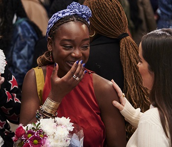 Caption:Dede Arisekola reacts to finding out she has won the British Fashion Council and British Library student research competition