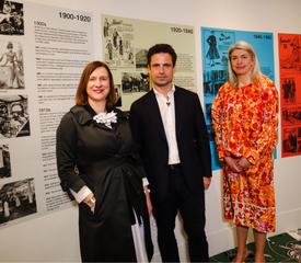 Caption: Emma Jane Goldsmith, Leo Fenwick and Kristen Pickering view the timeline at Exhibition 140. Image by Maddie Gunson