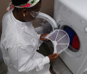 Caption: Lint filter inspection during tumble dryer studies.