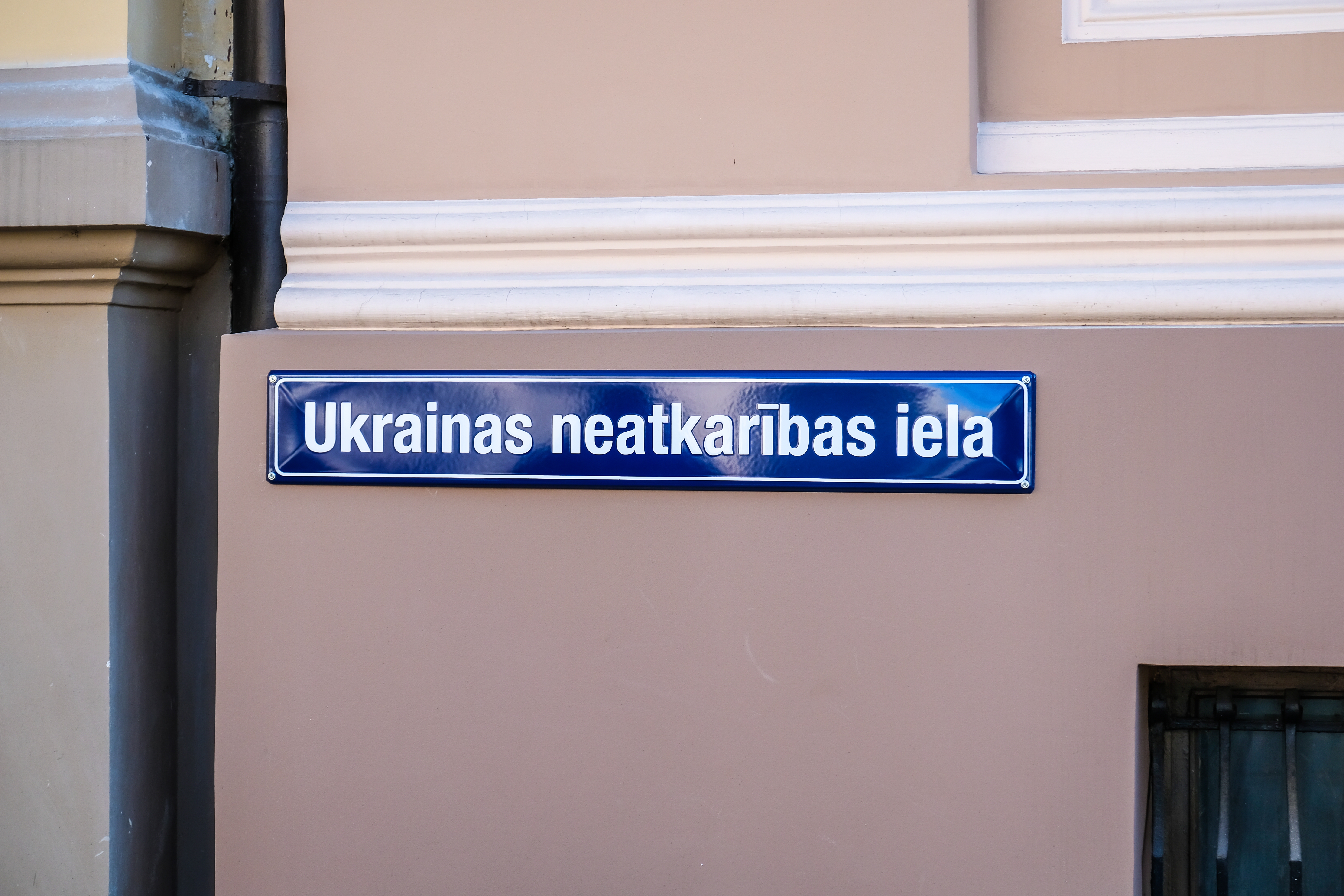 Street sign with the inscription Ukrainian Independence Street in the center of Riga. Shutterstock