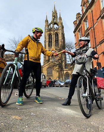 Caption:Shaun Cutler hands the relay baton to The Revd Canon Clare MacLaren