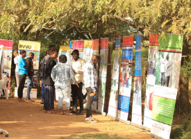 Caption: Photographs taken by young refugees were turned into a travelling exhibition which has already been staged at universities and refugee settlements in Uganda. 