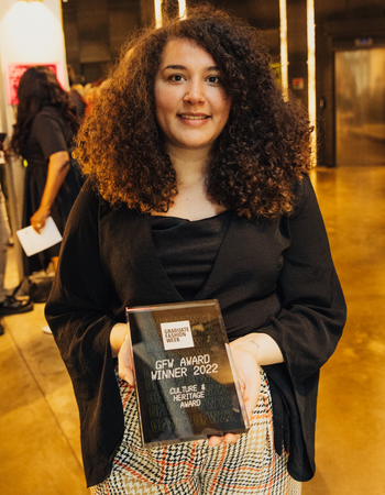 Caption: Levi Warren-Howard with her Culture and Heritage Award from Graduate Fashion Week 2022.