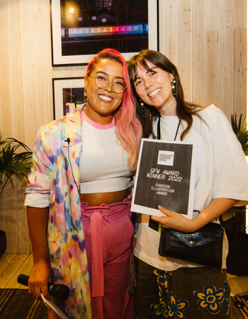 Caption: Writer and blogger, Megan Jayne Crabbe, presented Olivia Fletcher with her Fashion Illustration Award at Graduate Fashion Week 2022.