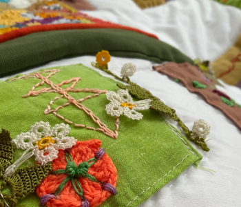 Caption: One of the patchwork squares created as part of the Embroidering Protection project.