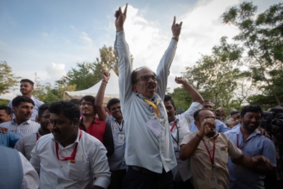 Caption: Employees of the Indian Space Research Organisation (ISRO) celebrate after the successful landing of Chandrayaan-3 mission on the moon.