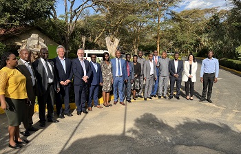 Caption:Professor Gavin Oxburgh (fifth from left) pictured in Kenya with representatives from Fair Trials, the African Policing Civilian Oversight Forum and the East African Police Chiefs Cooperation Committee.