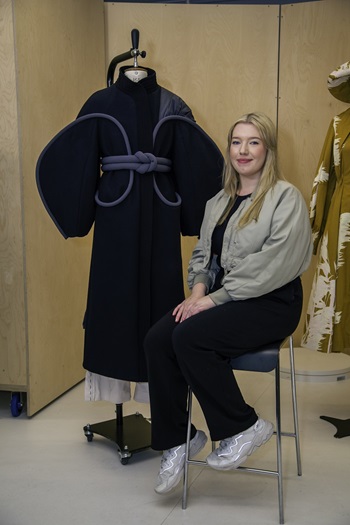 Caption: Fashion graduate Emily Gibson with her kimono-inspired outerwear.
