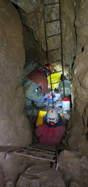 Caption: Researchers collecting samples from limestone bedrock deep below the ground in Goodluck Mine Derbyshire credit J White