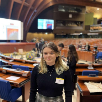 Caption: Cara Dunlop pictured at the World Forum for Democracy 2021