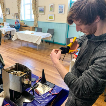 Caption: Dr Ollie Hemstock at one of the pop-up repair cafés.