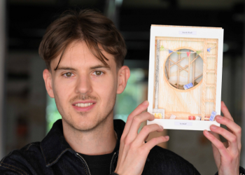 Caption: Liam Philpot is pictured in the Architecture studios at Northumbria University with some of his design work.