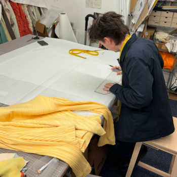 Caption: Harry pictured at work in London during his placement year.