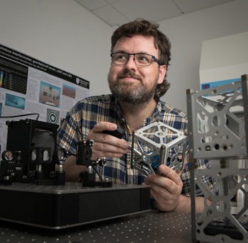 Caption:Professor Eamon Scullion, Professor of Space Technology, pictured during the early stages of the CubeSat development