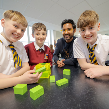 Caption: Northumbria Postgraduate Researcher Devesh Dhole constructs 3D models with pupils from Whytrig Middle School.