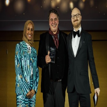 Dominic Simpson (centre) receives the Nurse Educator of the Year award