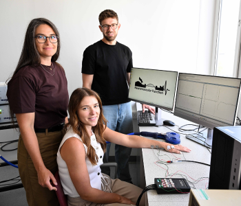 Caption: Dr Elisa Nédélec, Dr Emily Hume and Dr Paul Ansdell demonstrate some of the tests being carried out during a new study, funded by the MS Society. 