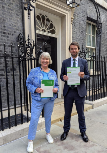 Caption: Professor Greta Defeyter OBE and Andrew Forsey OBE pictured outside 10 Downing Street.