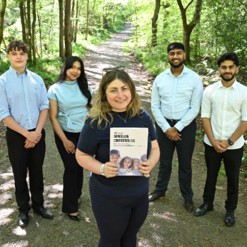 Caption: Clara May Warden (centre), founder of Dandelion Confidence, engages in fun forest activities with students from Northumbria University Business Clinic.