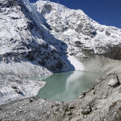 Dig Tsho glacial lake in the Langmoche valley, Nepal. The natural moraine dam impounding this lake breached catastrophically in 1985, causing extensive damage downstream. The High Mountain Asia region has the highest GLOF danger globally and accounts for the majority of the global population exposed to GLOFs.