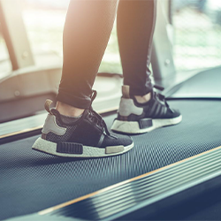 Pair of feet walking on a treadmill