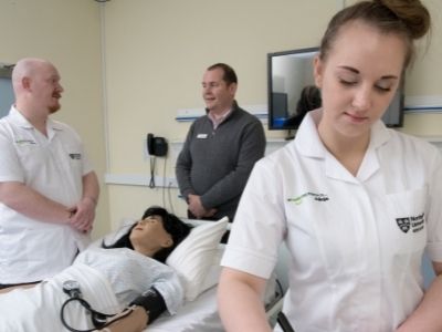 Caption: Chris Pointon meeting first year students David Simpson and Alicja Kleysa.
