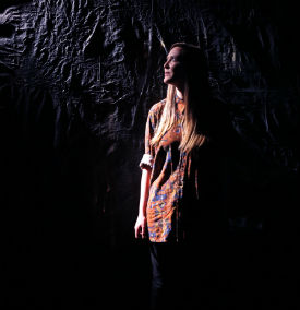 a woman standing in the dark