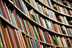 a close up of a book shelf filled with books